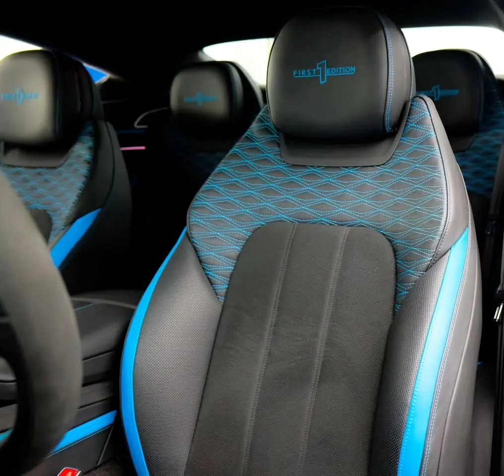 Detailed Bentley First Edition interior with blue-accented leather seats